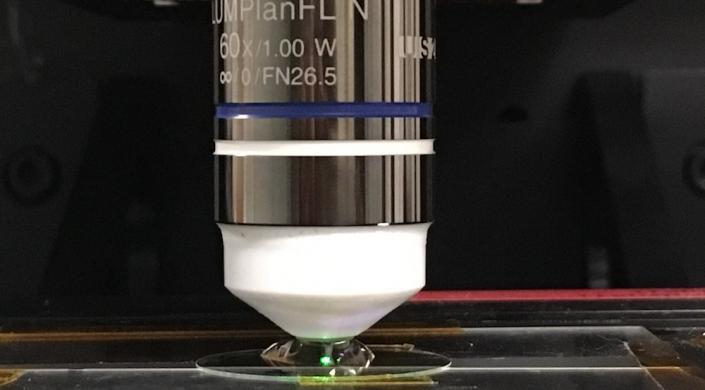 Harvard researchers integrated an immersion meta-lens into a commercial scanning confocal microscope, achieving an imaging spatial resolution of approximately 200 nm.